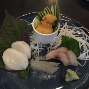 Thomas Takashi Cooke's sashimi plate, with day boat scallops, kombu-cured flounder, seared Spanish mackerel and local Maine sea urchin roe, served at a pop-up dinner at Bao Bao Dumpling House last week.