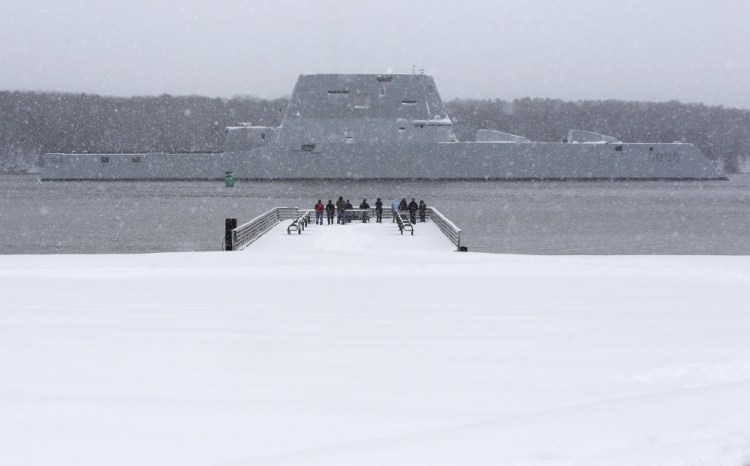 Costs for the Zumwalt-class destroyers are running about 3.7 percent, or $450 million, above estimates from the last fiscal year. Overruns are typical for the first ship in a new class, experts say. Here, the USS Zumwalt, the first in the class, makes it way down the Kennebec River as it heads out for sea trials in March.