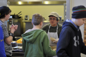 Jonathan Erskine, the cafeteria chef, serves students lunch at the Islesboro Central.