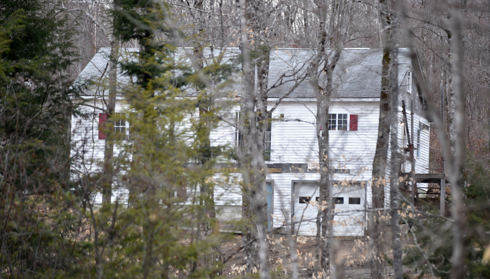 Maine State Police block off McNally Road in St. Albans on Friday as they investigate the death of Randy Erving, 53. Jeremy Erving, 24, a nephew of Randy Erving, has been charged with murder in connection with his uncle's death.
