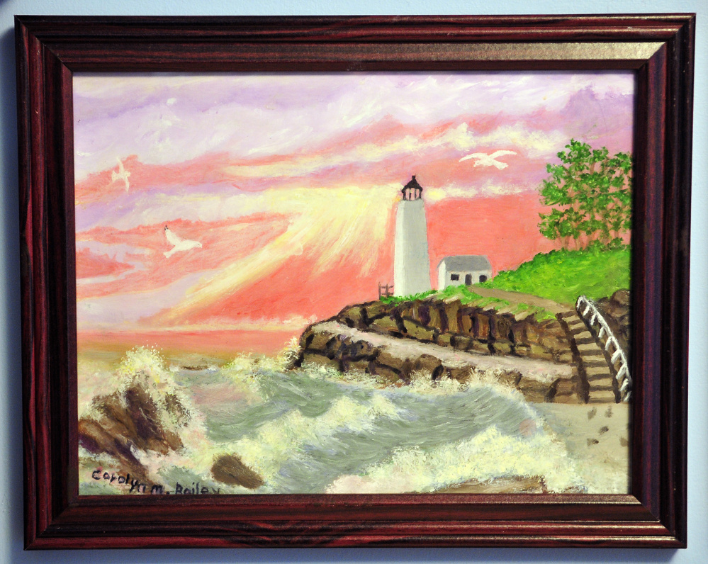 Carolyn Bailey's painting of a lighthouse, seen last week, is one of many of her works hanging in her Chelsea home.
