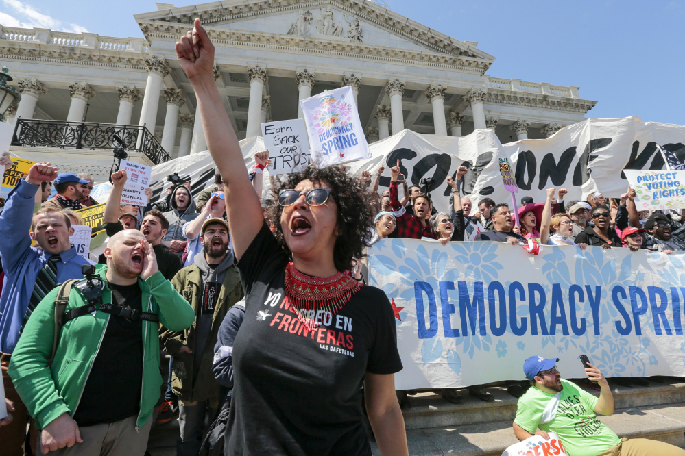 Alejandra Pablos of Arizona leads a chant as protesters stage a sit-in at the Capitol in Washington on Monday. More than 400 people were arrested as the protesters decried the role of money in politics. More protests are planned in Washington this week.