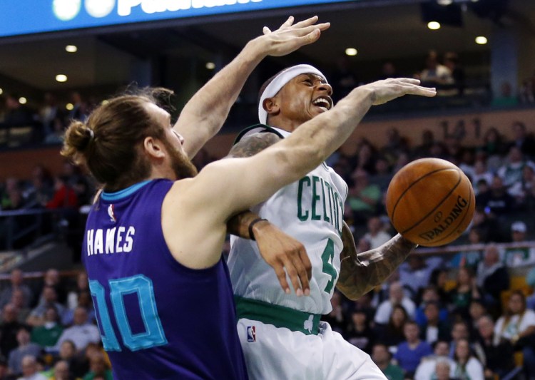 The Celtics' Isaiah Thomas tries to drive past Charlotte's Spencer Hawes in the first quarter of Monday night's game in Boston. It was a frustrating night for the Celtics, who were never really in the game.