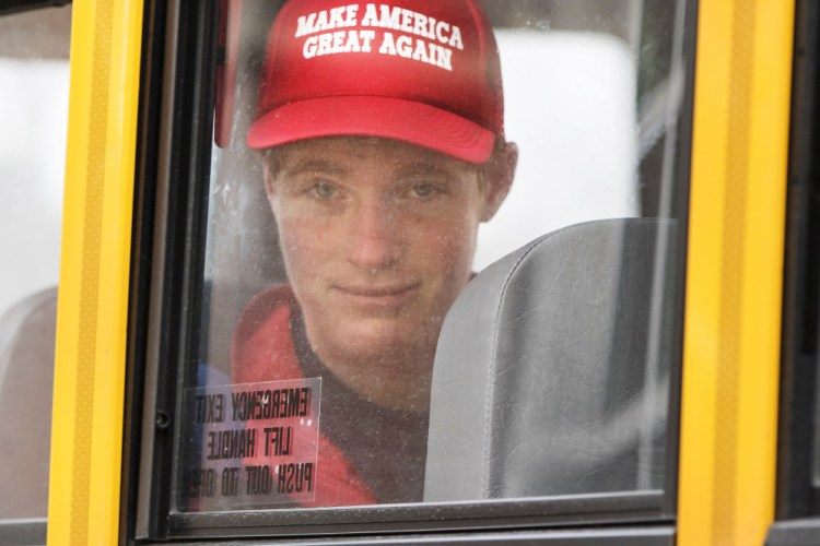 Connor Mullen leaves South Portland High School on the bus Monday. He says he supports Donald Trump because "I want a job ... where you can help people, and I've heard Trump say how important he thinks veterans and (people in law enforcement) are."
Ben McCanna/Staff Photographer