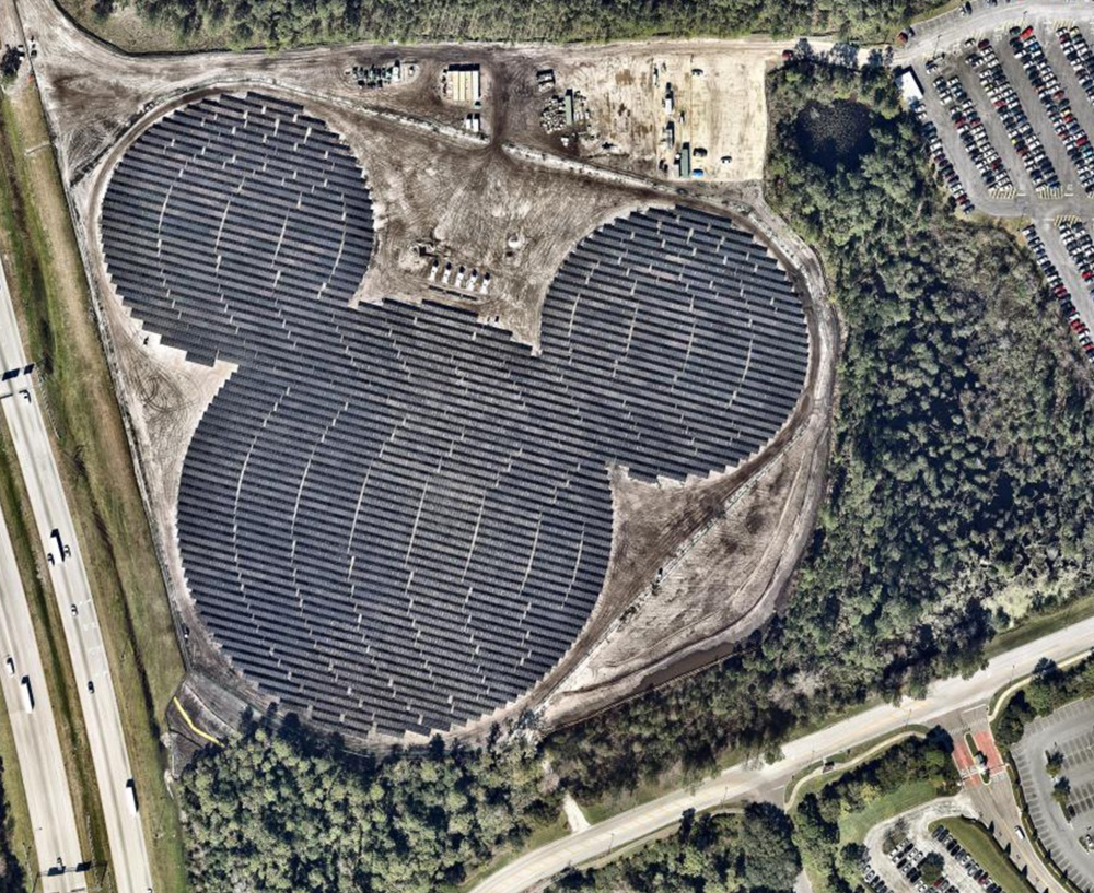 The solar farm near Epcot is a project of Walt Disney World and Duke Energy.  Epcot's Universe of Energy building has had solar panels on its roof since 1982.