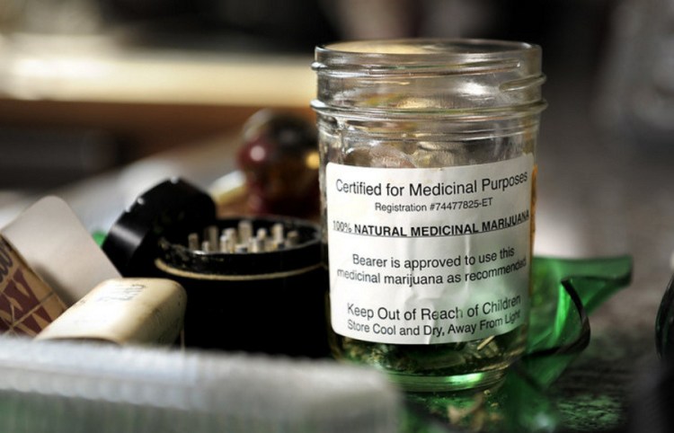 A jar of cannabis labeled "Certified for Medical Purposes" is seen in the home of patients Catherine and Glenn Lewis of Manchester, who use it to treat the recurring effects of a car crash. Lack of extensive clinical evidence keeps many Maine doctors from certifying patients to use medical cannabis.