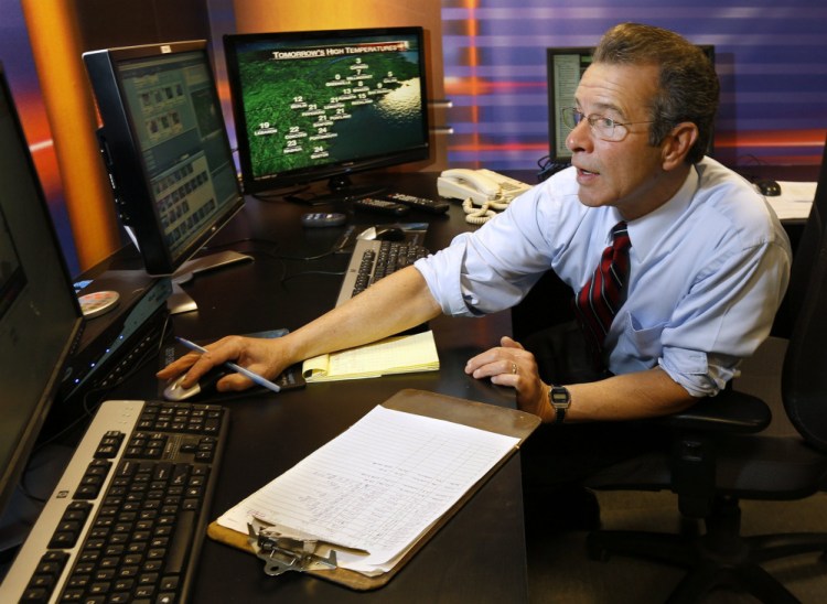 Meteorologist Joe Cupo prepares a forecast in 2013. During newscasts, he frequently mentions people who call in to tell him the weather conditions in the parts of Maine where they live.
