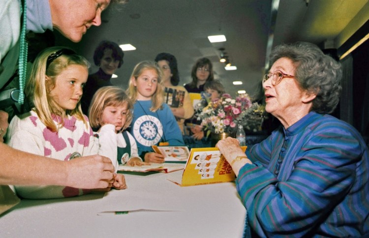 In this April 19, 1998, photo, Beverly Cleary signs books at the Monterey Bay Book Festival in Monterey, Calif. Even as she turns 100, the feisty and witty author remembers the Oregon childhood that inspired the likes of characters Ramona and Beezus Quimby and Henry Huggins in the children's books that sold millions and enthralled generations of youngsters. 
The Associated Press