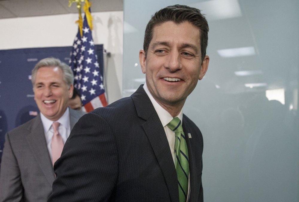House Speaker Paul Ryan and House Majority Leader Kevin McCarthy, left, have a light moment with reporters after a news conference Friday.
The Associated Press