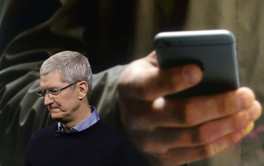 Apple CEO Tim Cook speaks at an event last month to announce new products at the company's headquarters in Cupertino, Calif. Apple, Microsoft and other tech giants are pushing back against the surveillance state in the courts.