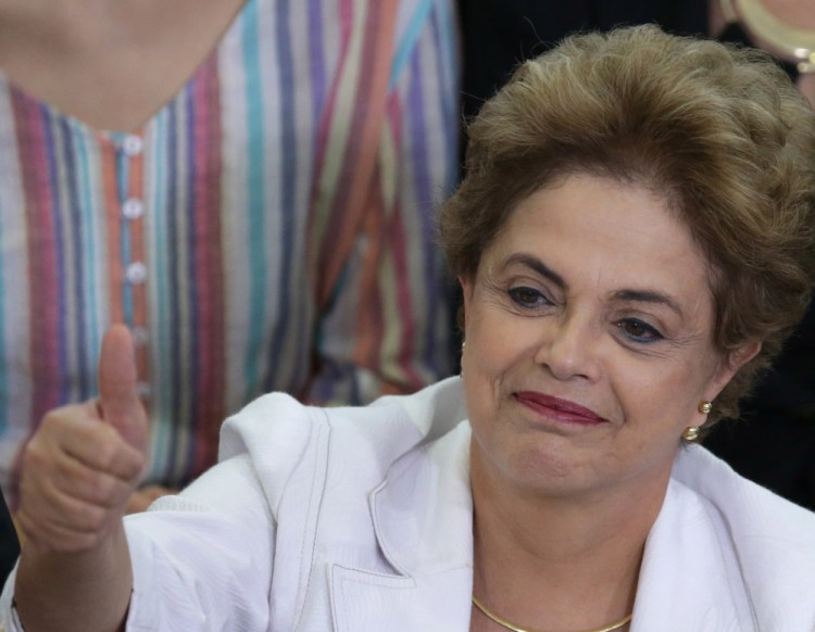 Brazil's President Dilma Rousseff gives a thumbs-up during an event at the presidential palace in Brasilia.