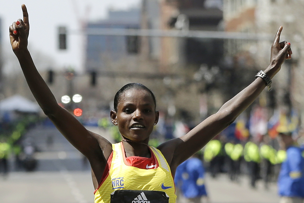 Atsede Baysa, of Ethiopia, crosses the finish line to win the women's division of the 120th Boston Marathon on Monday. The Associated Press