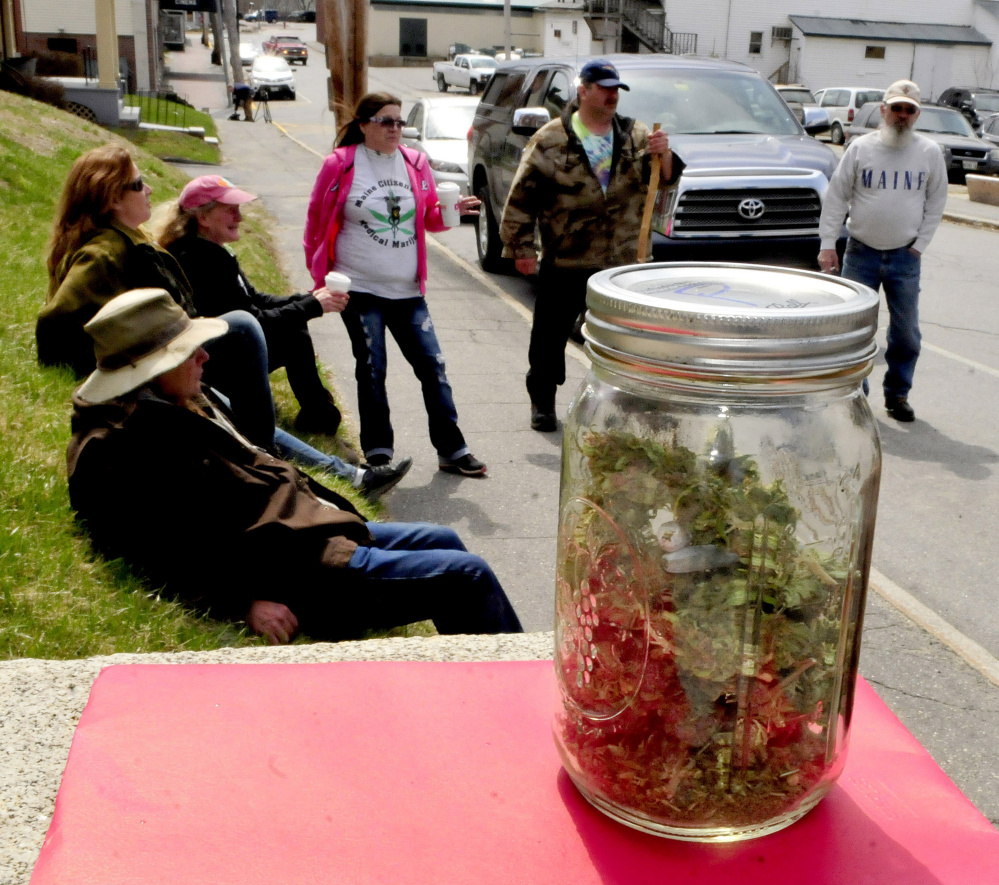 A large jar of marijuana was placed on the steps of the Somerset County Courthouse in Skowhegan as marijuana legalization advocates gathered to listen to Donny Christen.