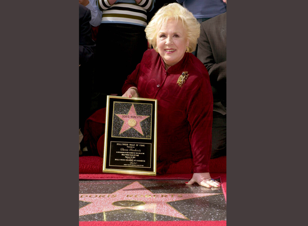 2003 Associated Press File Photo
Actress Doris Roberts poses by her star on the Hollywood Walk of Fame during a ceremony in Los Angeles. Family spokeswoman said that the "Everybody Loves Raymond" actress has died at 90.