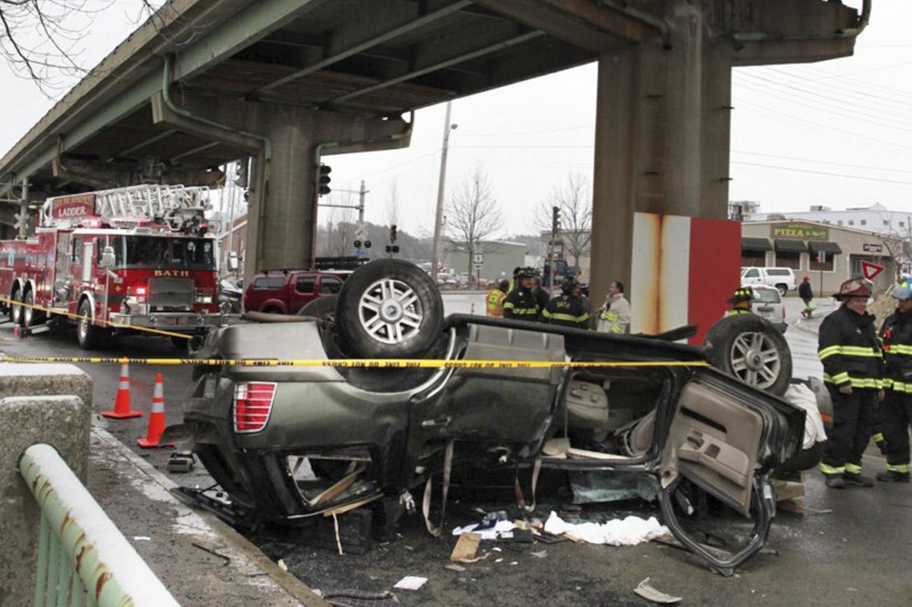 The SUV that crashed through the Bath Viaduct safety railing April 4 sits in the roadway below.