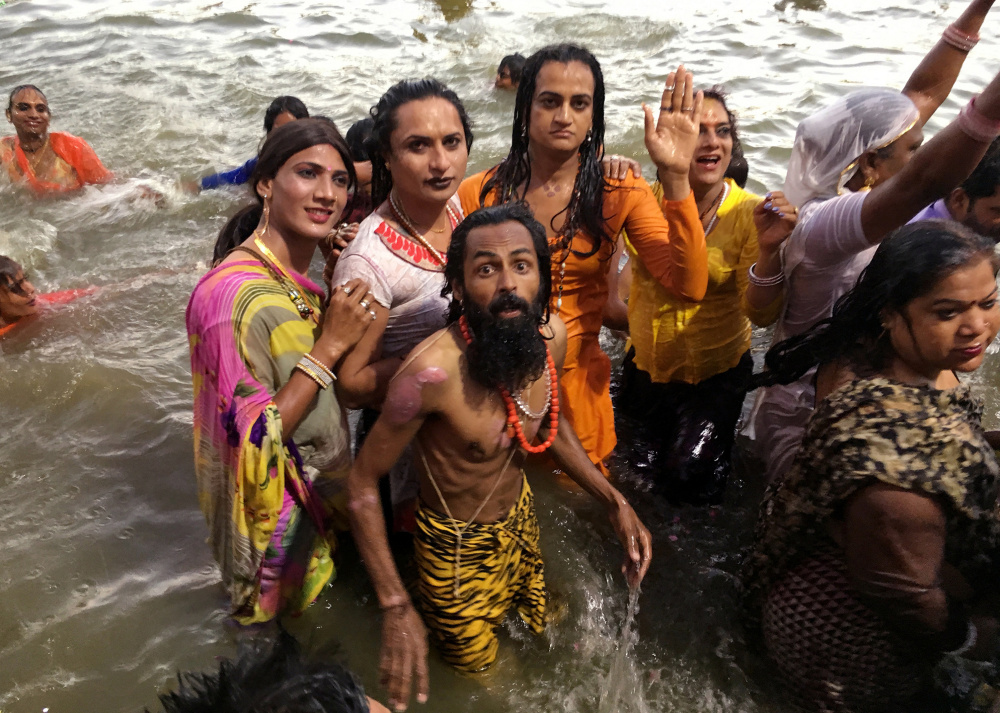 Transgender activists take a dip in the holy waters of the Shipra River at a Hindu festival in Ujjain, India, on Friday. A landmark 2014 Supreme Court ruling recognized a third gender.