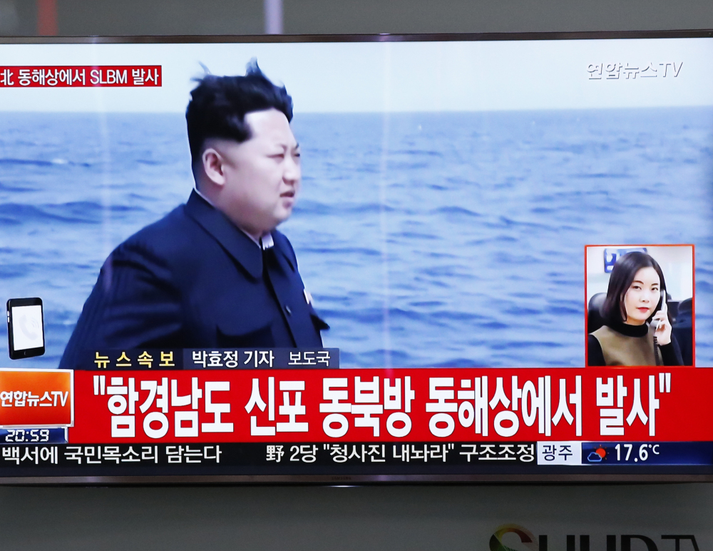 South Korean file footage broadcast Saturday shows North Korea leader Kim Jong Un and words that translate to: "North Korea fires submarine-launched ballistic missile or SLBM."