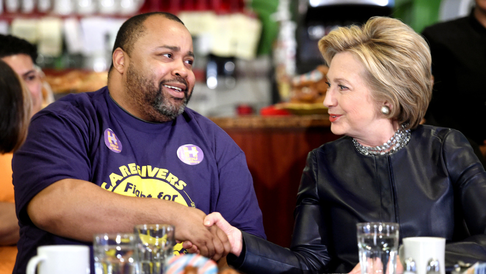 Terrell Williams shakes hands with Democratic presidential candidate Hillary Clinton during a campaign stop at Orangeside on Temple in New Haven, Conn., on Saturday.