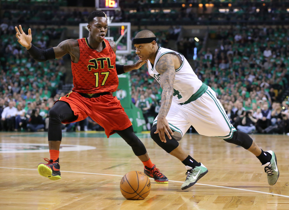 Isaiah Thomas drives against Atlanta guard Dennis Schroder during Game 4 of their first-round playoff series Sunday in Boston. Thomas scored 28 points as the Celtics evened the series with a 104-95 win in overtime.