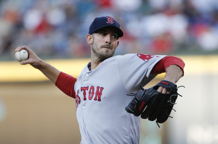 Red Sox starting pitcher Rick Porcello works in the first inning of Monday night's game in Atlanta. Porcello got his fourth with of the season, holding the Braves scoreless and pitching into the seventh inning.