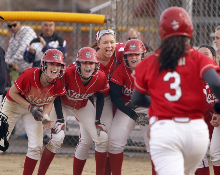 As her teammates await, Chloe Griffin of Scarborough trots to the plate Monday after hitting a two-run homer against Sanford that ignited the offense in a 13-4 victory.