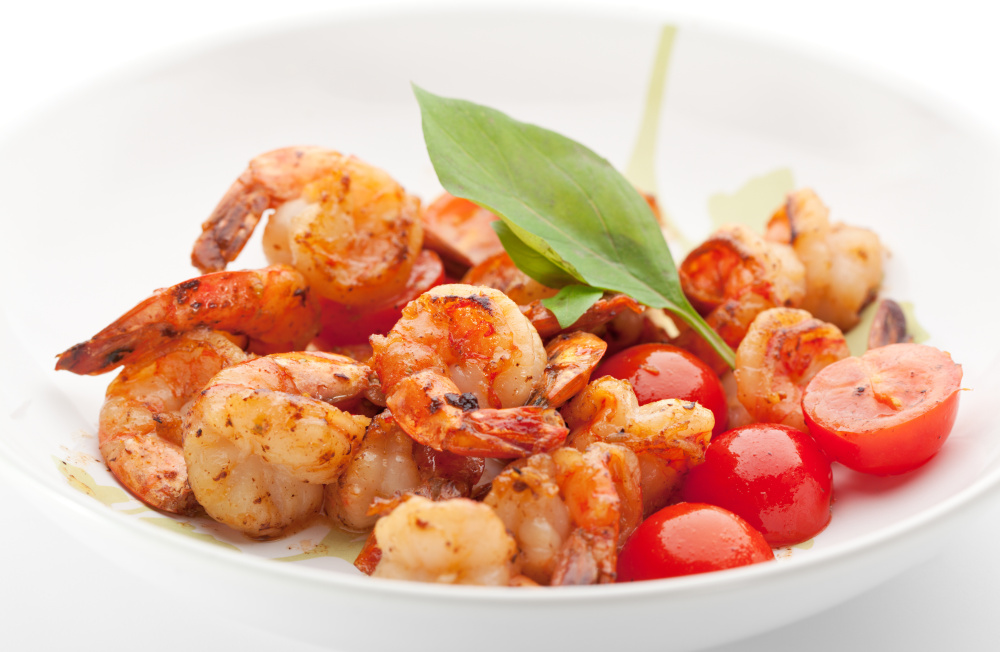 The herb is added to basil shrimp pasta after the orange peel is removed.