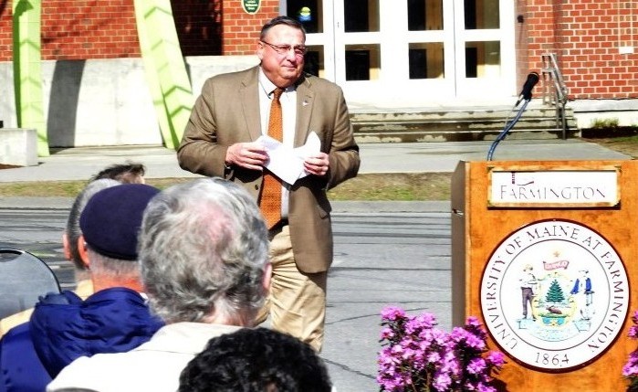 Gov. Paul LePage steps away from the lectern Tuesday while speaking during the dedication of the Theodora J. Kalikow Education Center at the University of Maine in Farmington after students held up signs criticizing him.