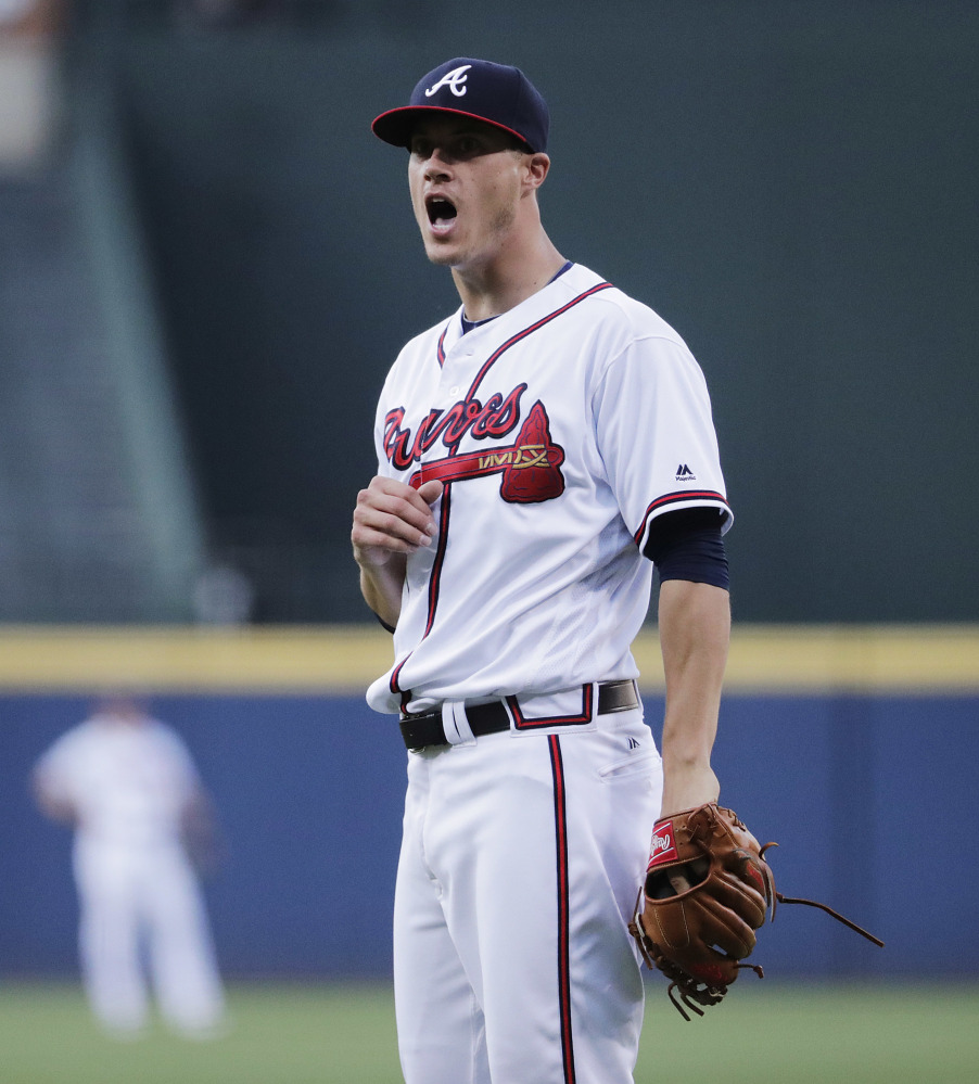 Atlanta Braves starting pitcher Matt Wisler reacts after giving up the three-run home run to Travis Shaw.