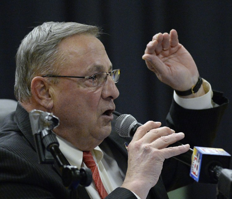Gov. Paul LePage speaks at Thursday night's town hall meeting in Damariscotta. He urged people in the audience to vote against a statewide ballot measure to raise Maine's minimum wage to $12 an hour.