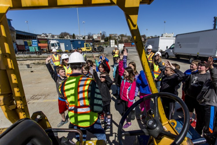 David Arnold of the Maine Port Authority leads students from Dyer Elementary School in South Portland on a tour of the International Marine Terminal in Portland on Thursday morning.