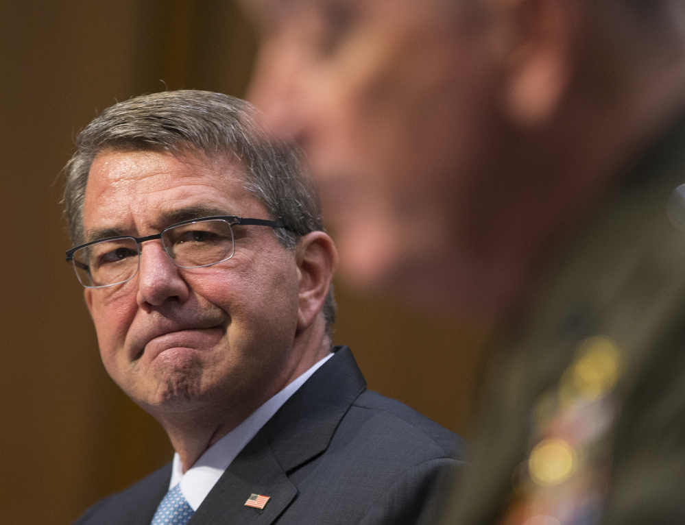 Defense Secretary Ash Carter, left, listens as Joint Chiefs Chairman Gen. Joseph Dunford testifies on Capitol Hill Thursday before the Senate Armed Services Committee.