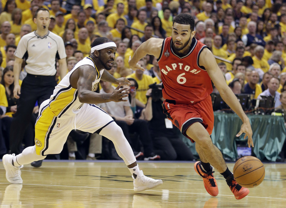 Cory Joseph of the Toronto Raptors goes to the basket against Ty Lawson of the Indiana Pacers during the first half of Indiana's 101-83 victory Friday night in Game 6 of their playoff series.