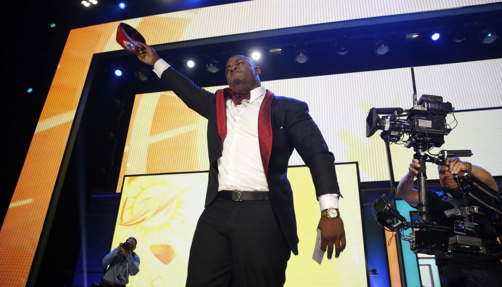 Mississippi State defenseive tackle Chris Jones celebrates after being selected by the Kansas City Chiefs as the 37th overall pick in the second round of the NFL draft.