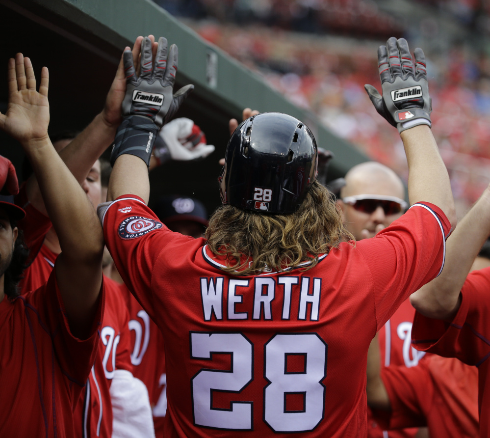 Jayson Werth is congratulated after hitting a sacrifice fly in the eighth inning of Washington's 6-1 win Saturday in St. Louis. Werth also hit a three-run homer.