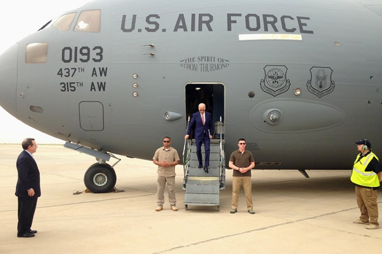 Vice President Joe Biden steps off a C-17 military transport plane upon his arrival in Baghdad on Thursday.