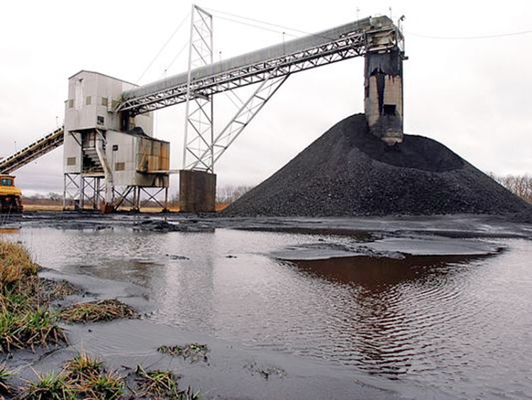 A conveyor belt moves coal mined underground  to the surface at Peabody Energy's Gateway Mine near Coulterville, Ill., in this 2006 file photo. Peabody had about 7,600 employees at the end of last year and has ownership stakes in 26 mines in the U.S. and Australia. The Associated Press