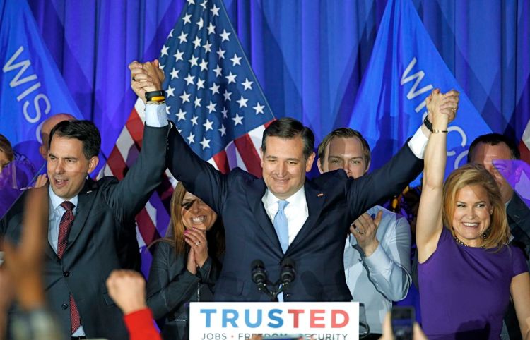 Republican presidential candidate Sen. Ted Cruz, R-Texas, raises hands with Wisconsin Gov. Scott Walker and his wife Heidi during a primary victory event, Tuesday in Milwaukee. Eevery delegate denied to Donald Trump will be considered a small but important victory by the anti-Trump forces. The Associated Press