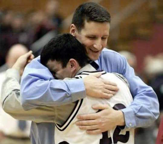 Coach Mike Adams and Josh Titus embrace after Edward Little High School's victory in its 2009 Eastern Maine championship game.
Photo courtesy Mike Adams