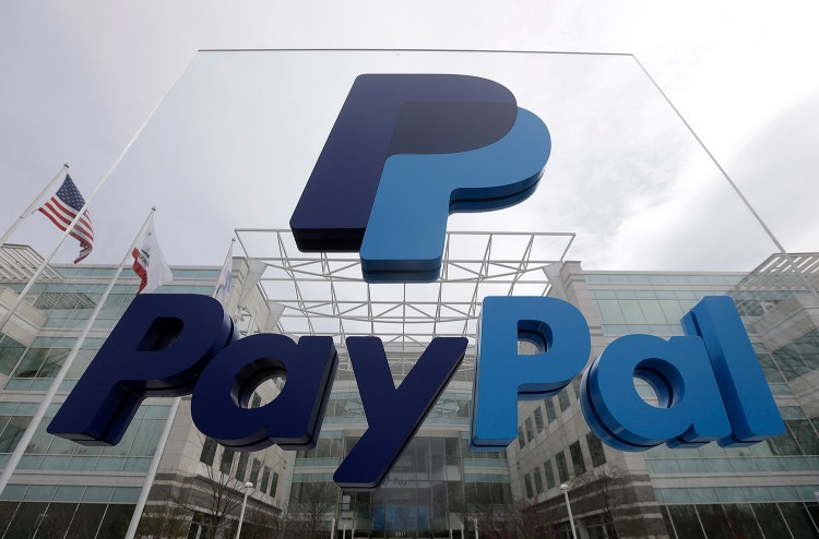 This March 10, 2015, file photo, shows signage outside PayPal's headquarters in San Jose, Calif. PayPal said on Tuesday it's canceling plans to bring 400 jobs to North Carolina after lawmakers passed a law that restricts protections for lesbian, gay, bisexual and transgender people. The Associated Press