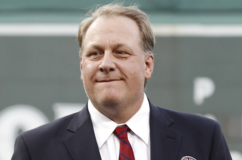 No charges will be filed against Curt Schilling's bankrupt company after a year-long investigation. Associated Press/Winslow Townson, File