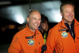 Solar Impulse 2 pilots Bertrand Piccard, left, and Andre Borschberg celebrate after Piccard landed their solar-powered plane at Moffett Field in Mountain View, Calif.,  on Saturday. The Associated Press