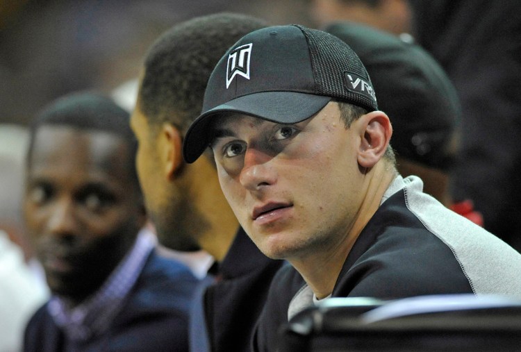 Then-Cleveland Browns quarterback Johnny Manziel watches a Dallas Mavericks vs. Cleveland Cavaliers NBA game in Cleveland in this 2014 photo. Reuters