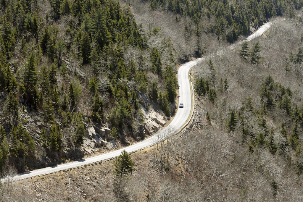 MOUNT DESERT ISLAND, ME - APRIL 30: A lone car travels along the Park Loop Road in Acadia National Park on Saturday, April 30, 2016. The National Park Service estimates that 2.5 million people visit the park annually and many locals take advantage of the lack of crowds during the quiet shoulder seasons. Gregory Rec/Staff Photographer