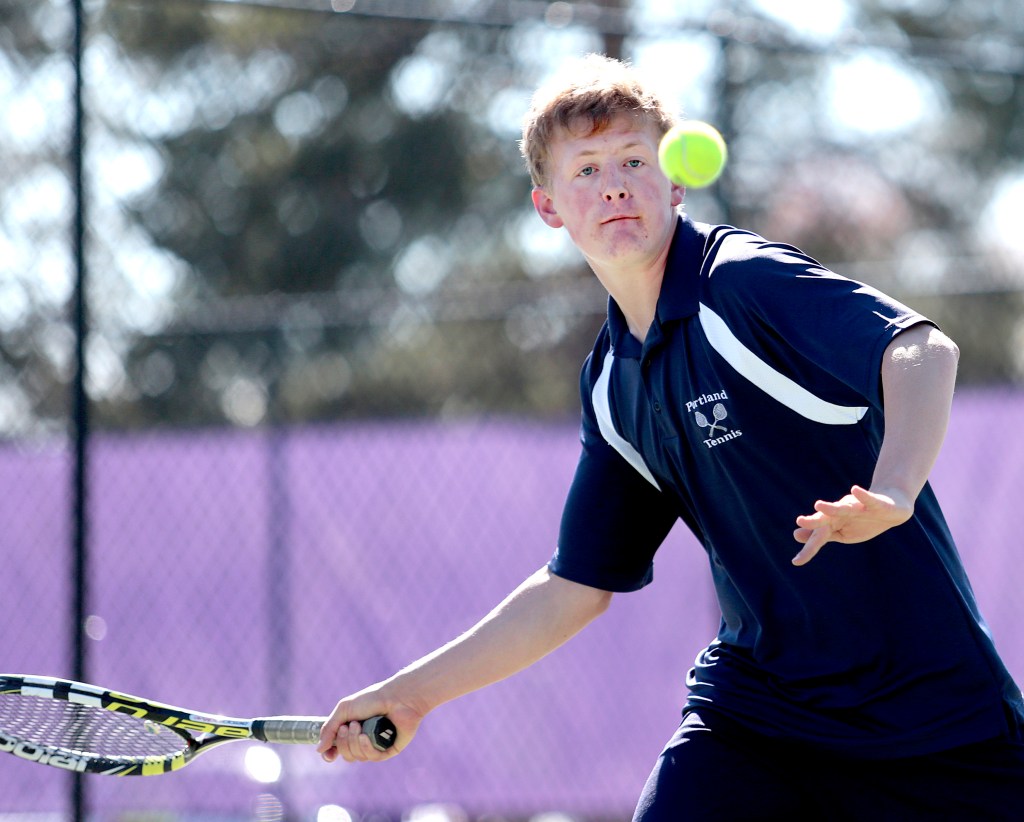 Portland sophomore Quinn Clarke sizes up the ball as he prepares to hit it during a tennis match at Deering Wednesday.
Gabe Souza/Staff Photographer
