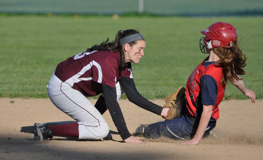 Greely shortstop Moira Train applies the tag to GNG's Hannah Dixon, on a steal attempt in the fifth inning.
John Ewing/Staff Photographer