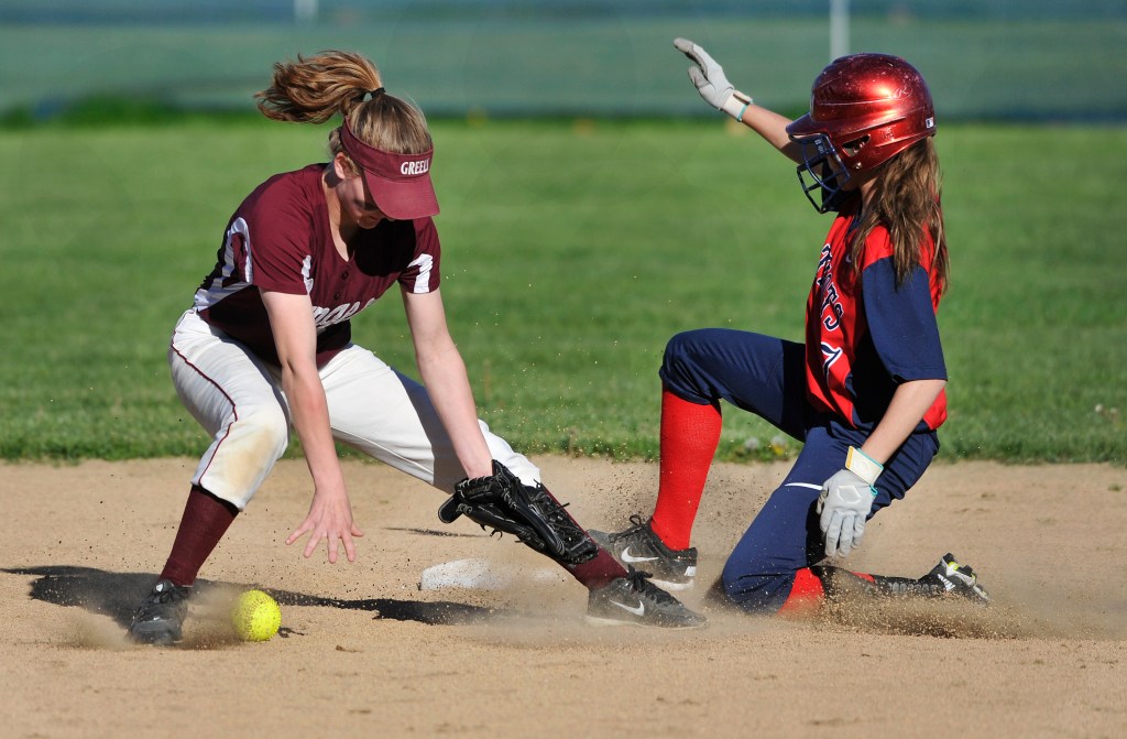 GNG's Cara Waltz slides into second base safely with a double in the third inning. Taking the throw is Greely second baseman Lexi Faietta.
John Ewing/Staff Photographer