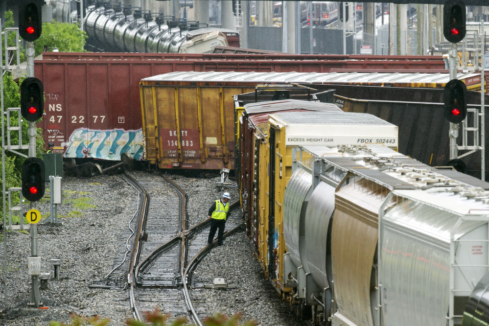 Several cars remain overturned after a CSX freight train derailed in Washington on Sunday near a Metro stop in Washington, D.C.