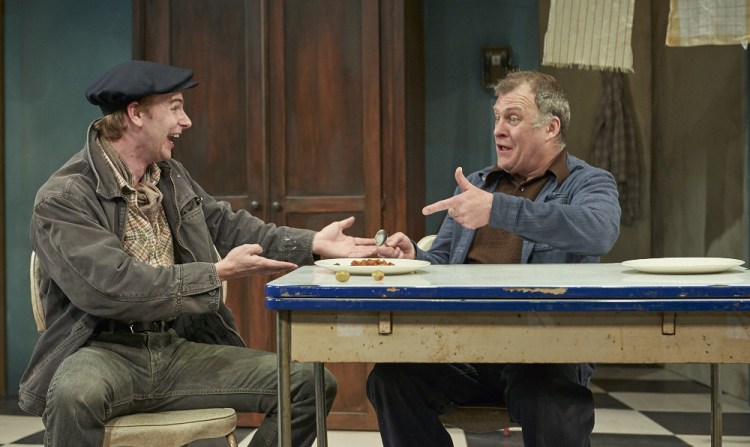 Luigi (Timothy Hassler) and Giovanni (William Zielinksi) share a meal.