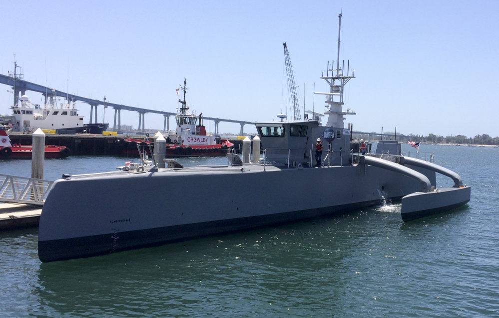 A self-driving, 132-foot military ship sits at a maritime terminal Monday in San Diego. The vessel will be tested for two years to see if it can navigate itself and avoid collisions as it could possibly spend months at a time at sea with no crew aboard.