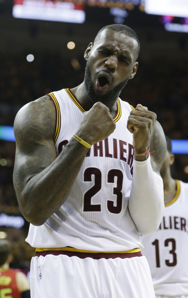 Cleveland's LeBron James celebrates in the second half of the Cavaliers' 104-93 win over the Atlanta Hawks in Game 1 of the second-round playoff series Monday in Cleveland. James scored 25 points and Cleveland beat Atlanta for the eighth straight time.